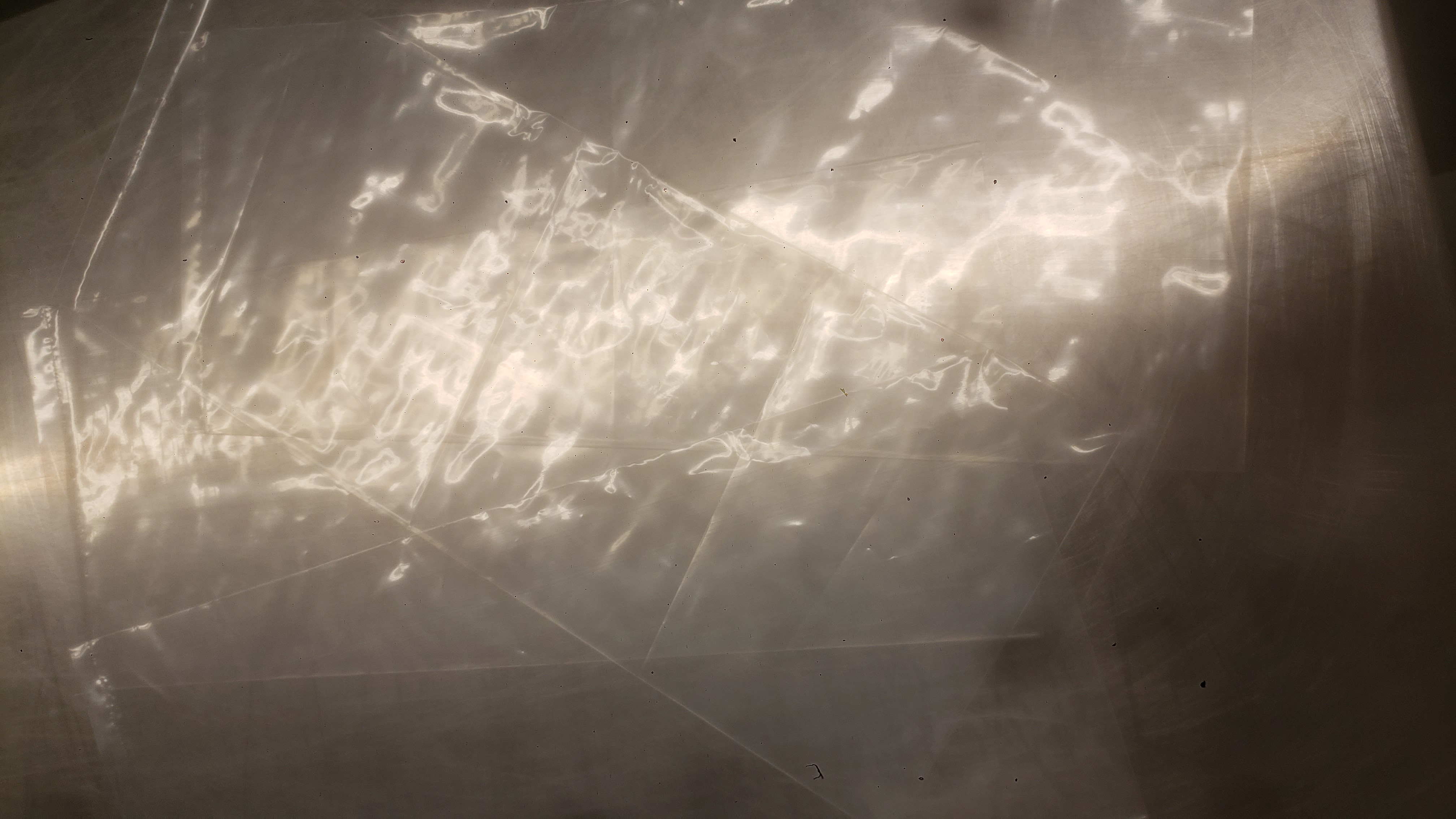 Bags on a metal table.